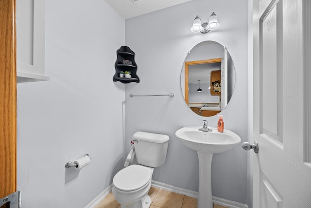 bathroom featuring toilet and tile patterned flooring