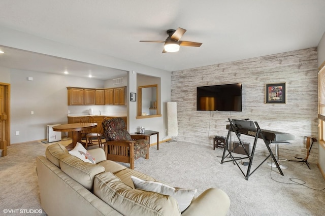 living room with ceiling fan and light colored carpet