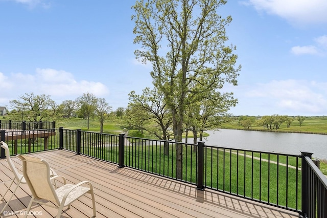 deck featuring a water view and a yard