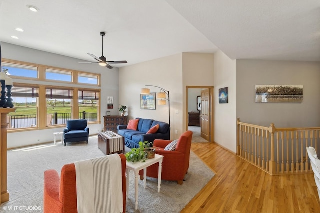 living room featuring ceiling fan and light hardwood / wood-style flooring