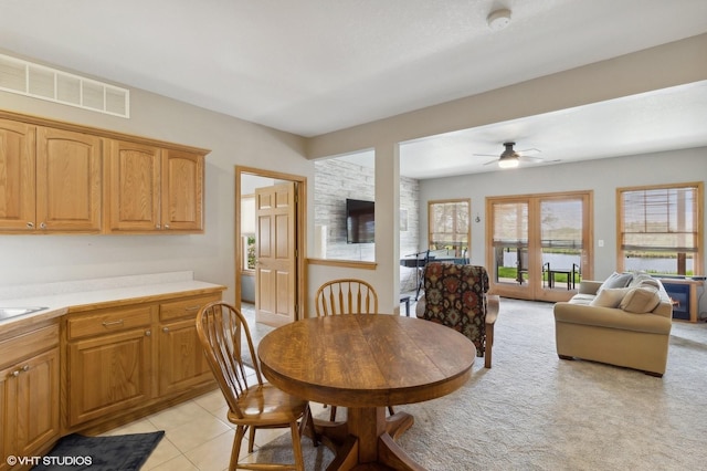 dining room with ceiling fan and light tile patterned floors