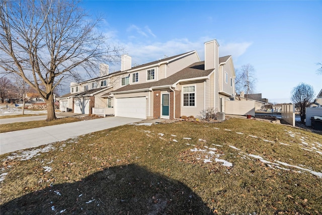 view of front of home featuring a garage and a front yard