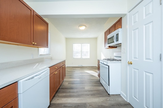 kitchen with wood-type flooring and white appliances