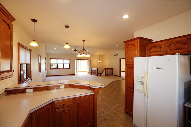 kitchen featuring kitchen peninsula, dark carpet, decorative light fixtures, vaulted ceiling, and white refrigerator with ice dispenser