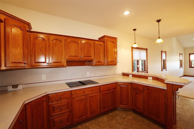 kitchen with hanging light fixtures, black electric cooktop, and kitchen peninsula