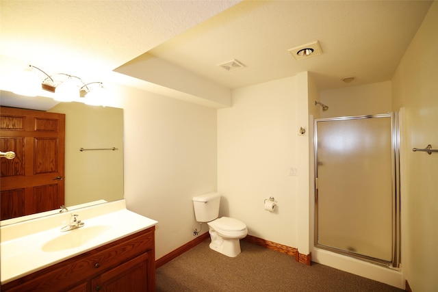 bathroom featuring toilet, walk in shower, and vanity