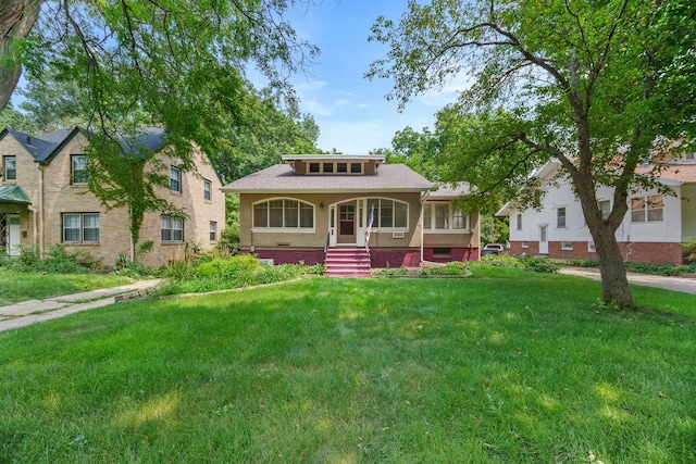 view of front of home with a front lawn and covered porch