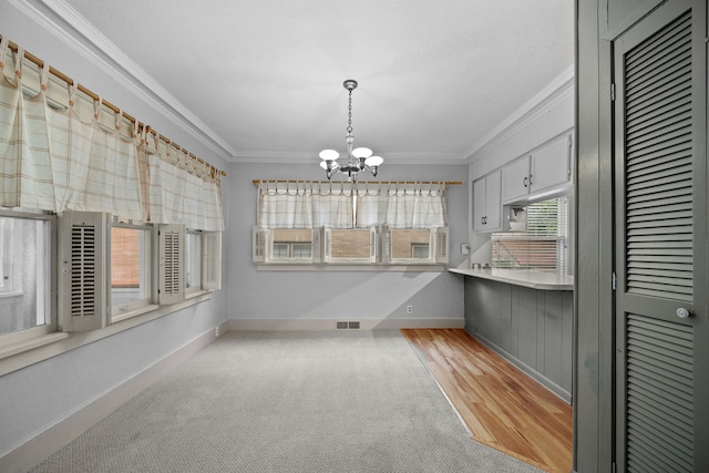 1001 42nd St, Des Moines, IA 50311 - unfurnished sunroom featuring a chandelier