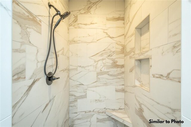 bathroom featuring tiled shower