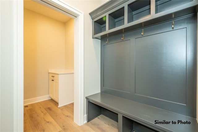 mudroom with light hardwood / wood-style floors