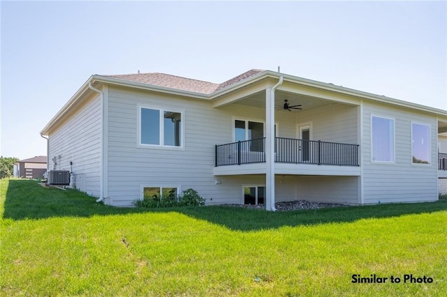 rear view of property with ceiling fan, a balcony, central air condition unit, and a yard