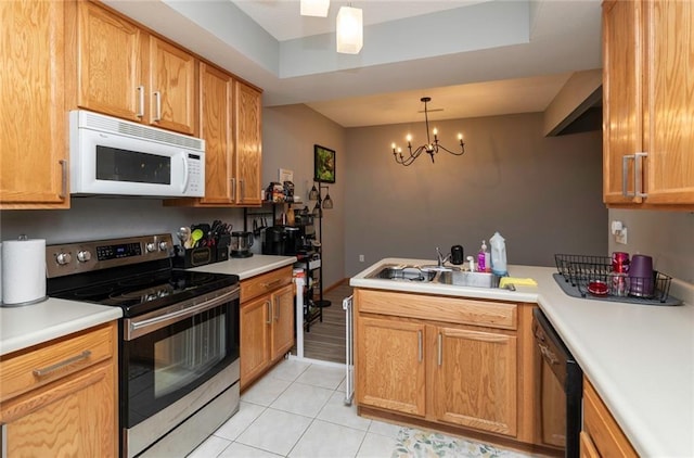 kitchen with dishwasher, pendant lighting, light tile patterned flooring, sink, and stainless steel electric range oven