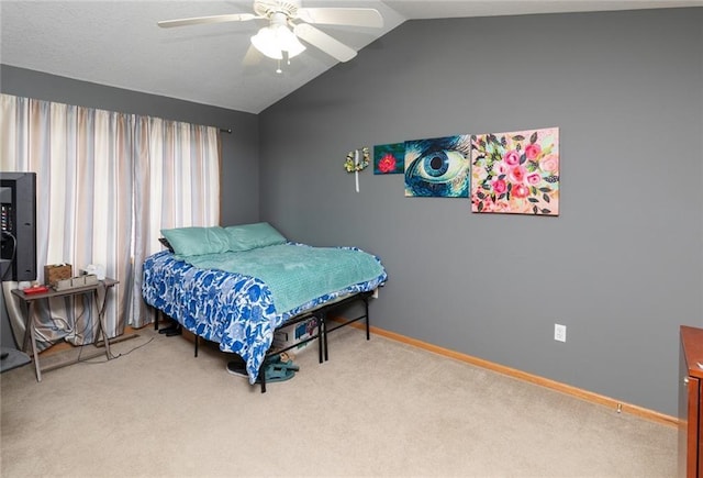 bedroom with ceiling fan, vaulted ceiling, and carpet