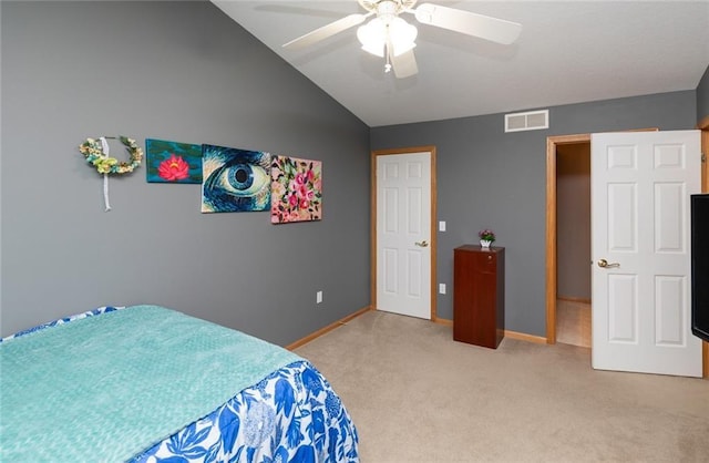 carpeted bedroom featuring ceiling fan and vaulted ceiling