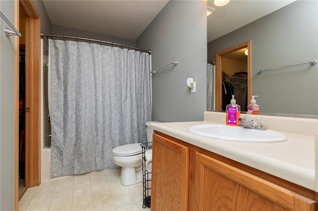 full bathroom featuring shower / bath combo with shower curtain, toilet, and vanity