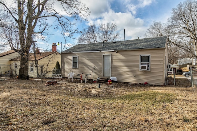 rear view of property with a yard and cooling unit