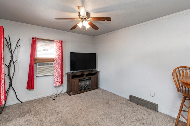 carpeted living room with crown molding, cooling unit, and ceiling fan