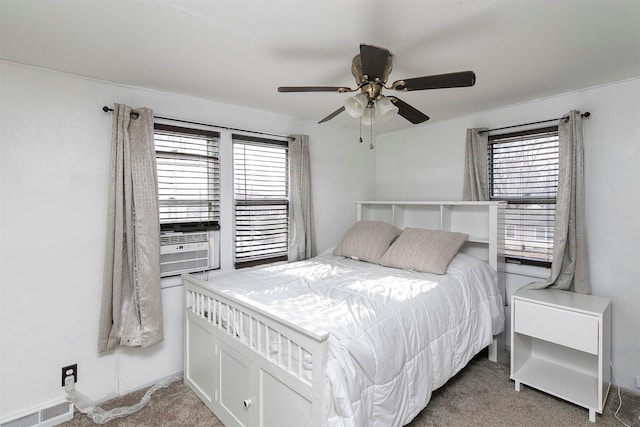 carpeted bedroom featuring cooling unit and ceiling fan