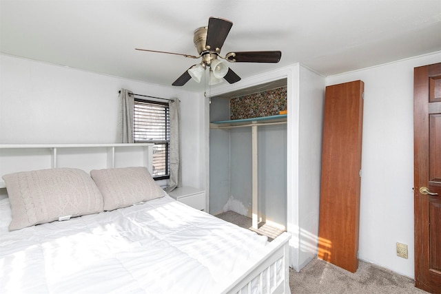 carpeted bedroom featuring a closet and ceiling fan