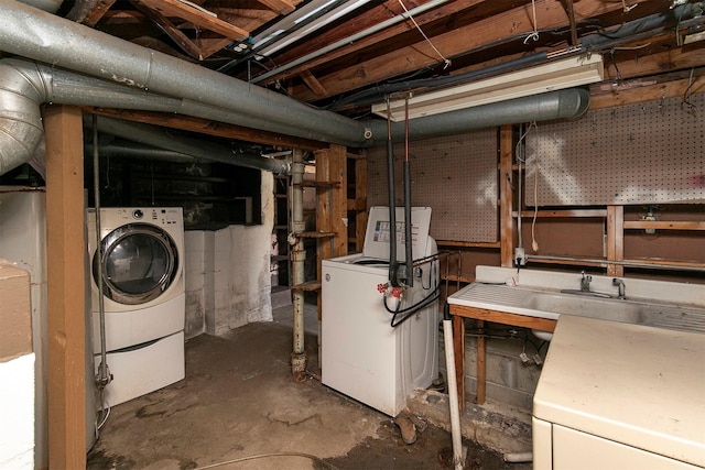 basement featuring sink and washer / clothes dryer