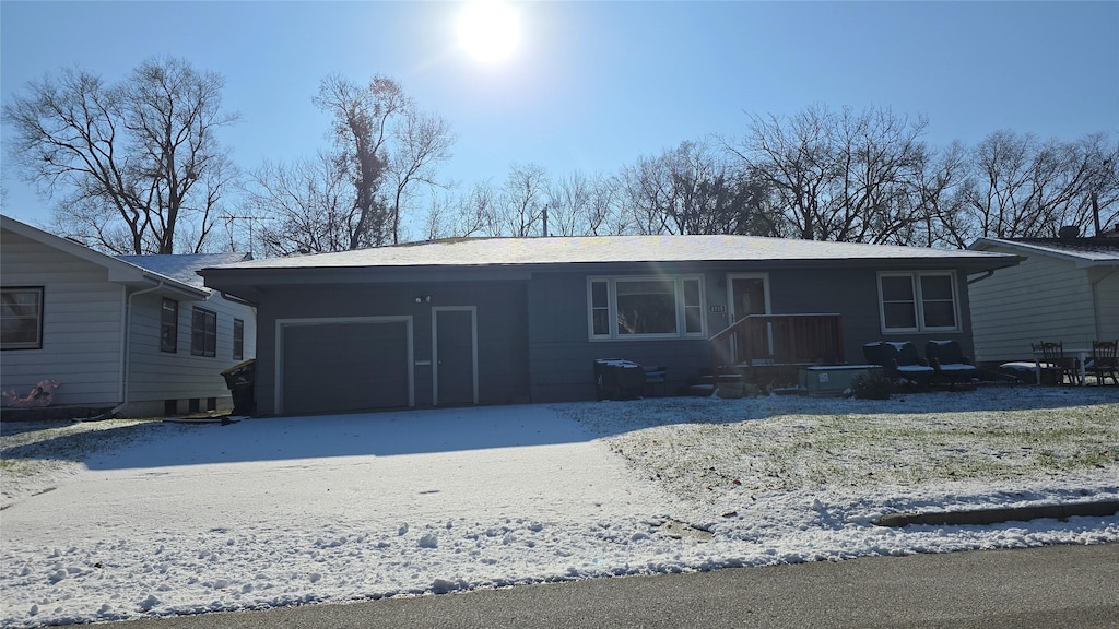 single story home featuring a garage