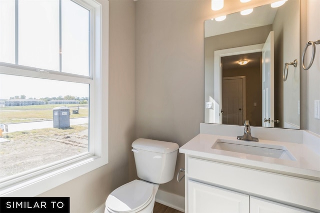 bathroom featuring toilet and vanity