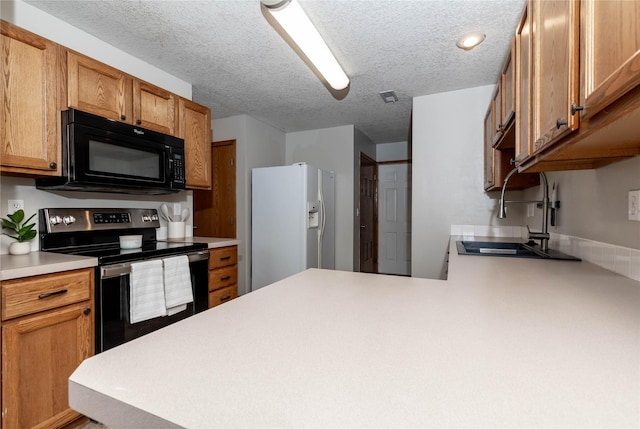 kitchen with kitchen peninsula, electric range, sink, a textured ceiling, and white fridge with ice dispenser