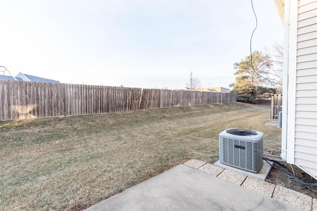 view of yard featuring cooling unit and a patio area