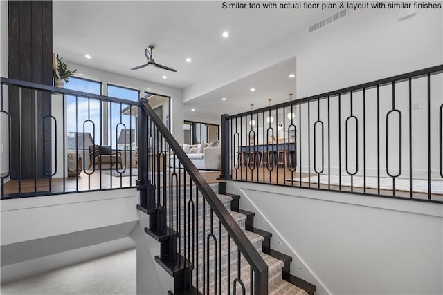 stairway with ceiling fan