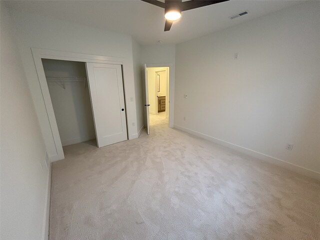 3034 NW Beechwood Dr, Grimes, IA 50111 - unfurnished bedroom with light colored carpet, a closet, and ceiling fan