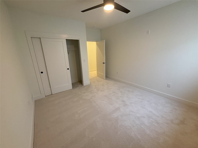 3034 NW Beechwood Dr, Grimes, IA 50111 - unfurnished bedroom with light carpet, a closet, and a ceiling fan