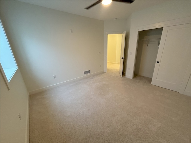 3034 NW Beechwood Dr, Grimes, IA 50111 - unfurnished bedroom featuring light colored carpet, a closet, and a ceiling fan