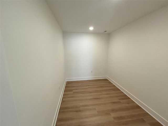 3034 NW Beechwood Dr, Grimes, IA 50111 - spare room with wood finished floors and recessed lighting