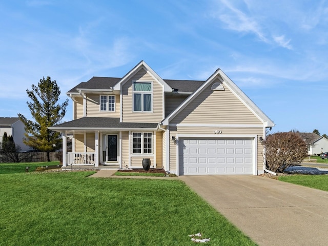 view of front of home with a front lawn, a garage, and covered porch