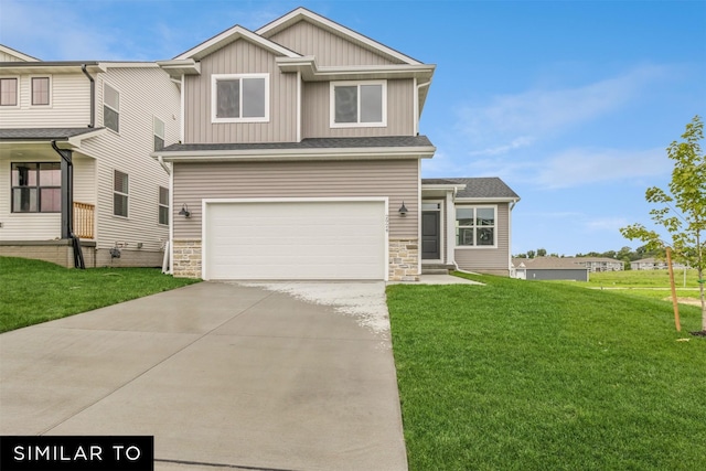 view of front of house featuring a front lawn and a garage