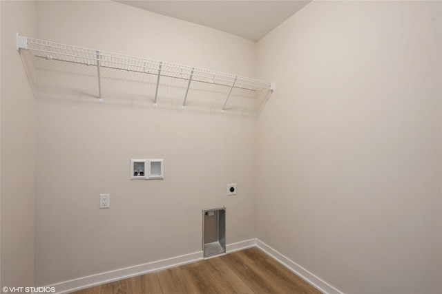 laundry area featuring dark wood-style flooring, baseboards, hookup for a washing machine, electric dryer hookup, and laundry area