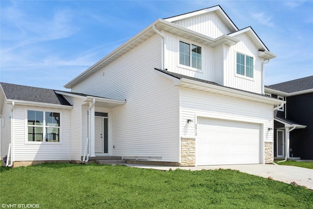 view of front of property with concrete driveway, a front lawn, stone siding, board and batten siding, and an attached garage