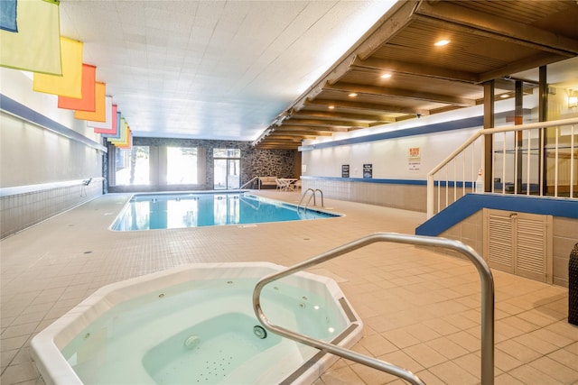 view of pool with an indoor in ground hot tub