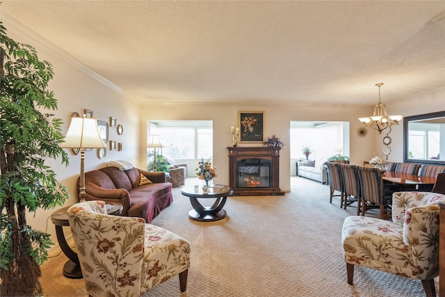 living room featuring a chandelier, carpet, crown molding, and a textured ceiling