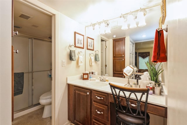 bathroom featuring toilet, walk in shower, and vanity