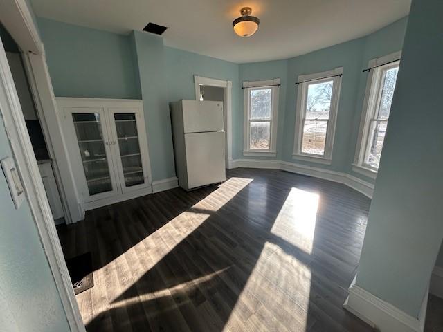 interior space with dark wood-type flooring