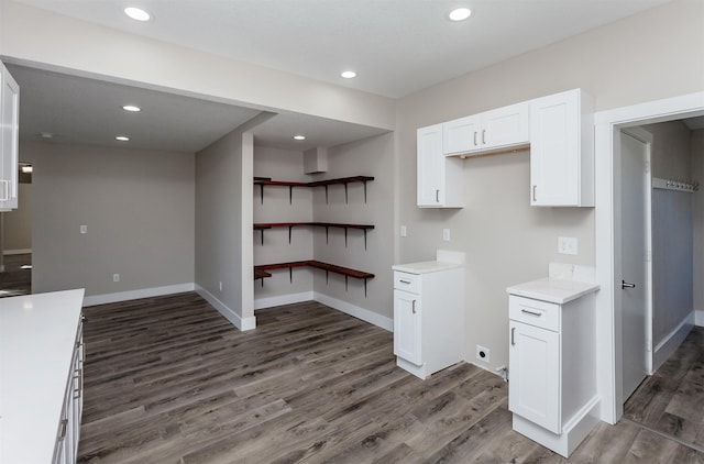 kitchen featuring white cabinetry and dark hardwood / wood-style floors