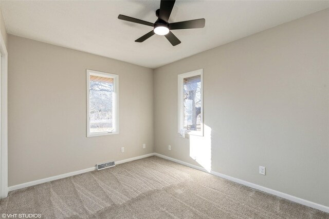 empty room with carpet and ceiling fan