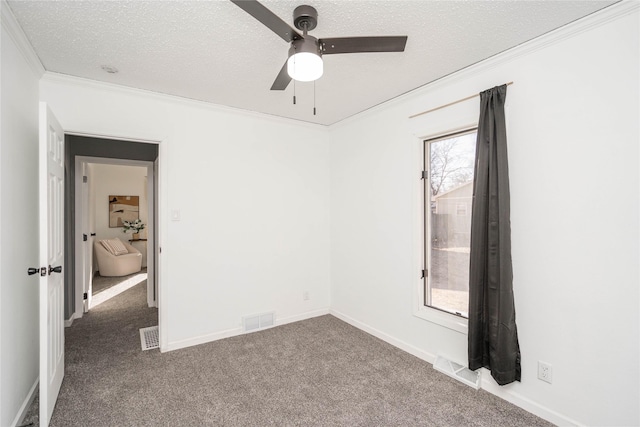 unfurnished bedroom featuring carpet, a textured ceiling, ceiling fan, and ornamental molding