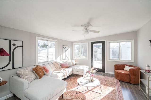 living room with ceiling fan, wood-type flooring, and lofted ceiling