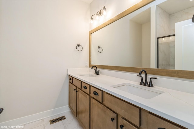 300 NW Ashley Ave, Waukee, IA 50263 - full bathroom with baseboards, marble finish floor, a sink, and visible vents