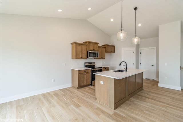 300 NW Ashley Ave, Waukee, IA 50263 - kitchen featuring brown cabinetry, light countertops, a sink, and appliances with stainless steel finishes