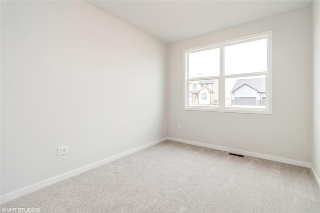 300 NW Ashley Ave, Waukee, IA 50263 - unfurnished room with carpet, visible vents, and baseboards