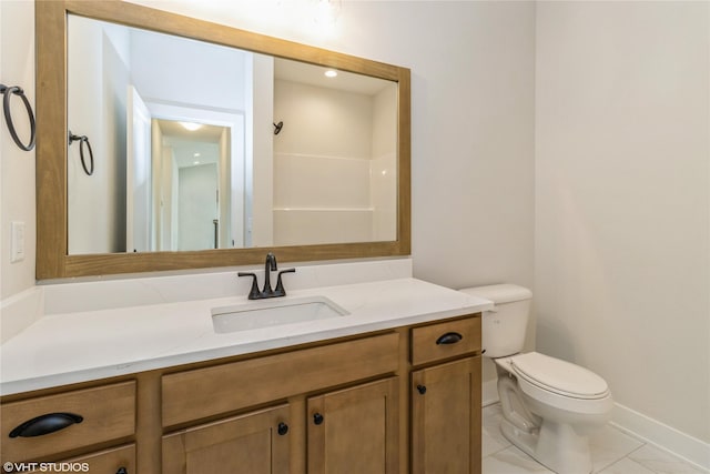 300 NW Ashley Ave, Waukee, IA 50263 - bathroom featuring vanity, baseboards, and toilet