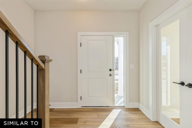 foyer with light wood-type flooring